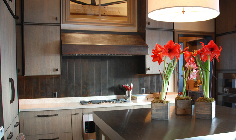 The Lake Creek Residence Kitchen with Antique Brown Black Oven Hood and Backsplash.