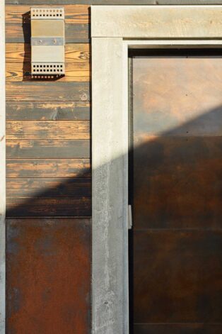 This siding is a combination of 16g steel panels, Shou Sugi Ban burned wood and our newest creation, "Crete Board."