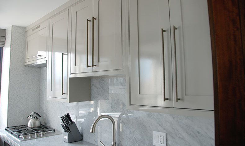 NYC East 84th St Remodel. Custom made kitchen cabinet doors with marble countertop.
