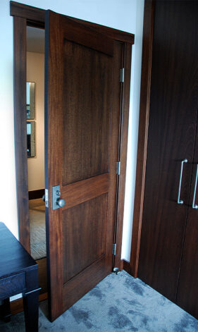 Mahogany Slab Bi-Fold Closet Doors and Mahogany Recessed Panel Door.