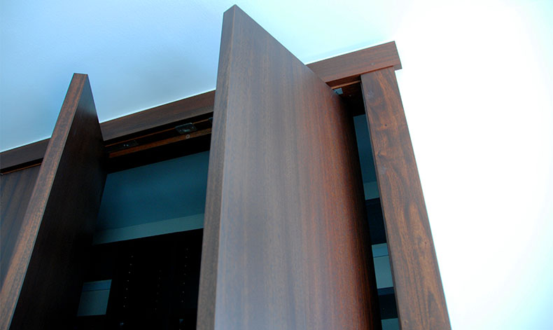 Mahogany Slab Bi-Fold Closet Doors Detail Open.