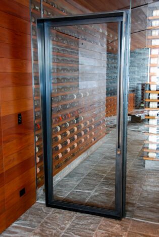 Slopeside Wine Cellar Custom Glass and Steel Door