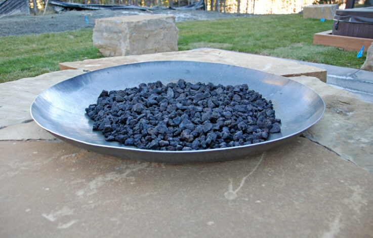 The Dish Fire Pit can be plumbed for gas or burn wood.