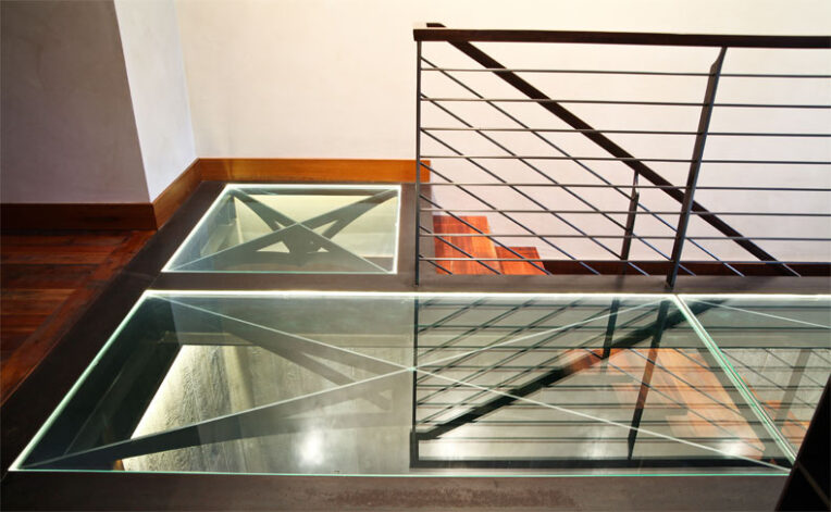 Bridger Stair and Railing made of acid washed steel, reclaimed Mahogany treads and Black Walnut hand rail.