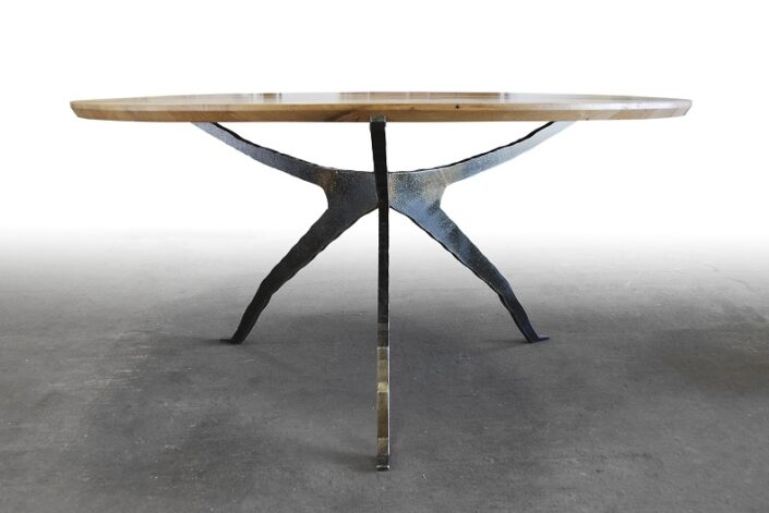 Spider Table with hand-made steel base colored with acid patinas and top made from reclaimed Chestnut milled from old barn beams.