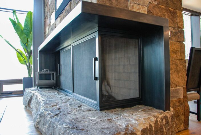 Sliding Fireplace Doors hand finished with a black patina.