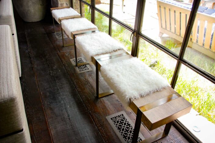 "The Fur Bench" with White Fur dressing on a Black Walnut slab with hand patina'd steel banded legs.