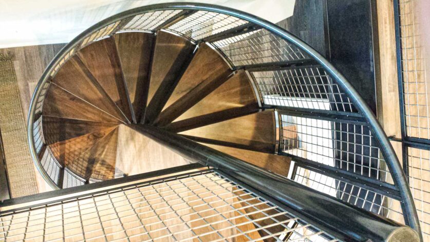 Brandner Design "Ennis Spiral Stair" hand-made in metal with modern industrial style.