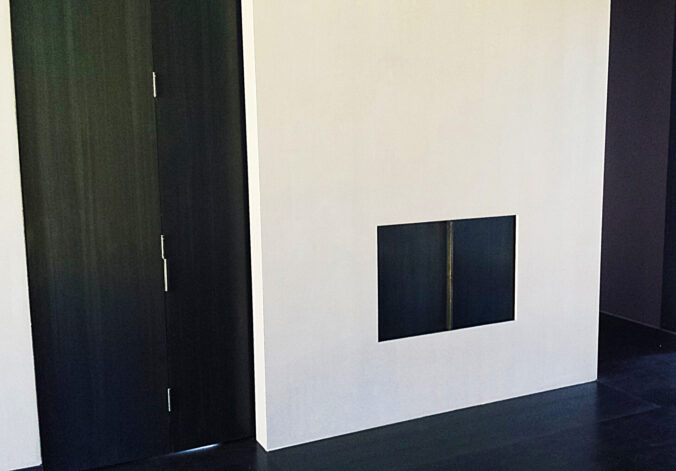 "Hilltop Modern" Guillotine Fireplace built with vertical and horizontal sliding steel insulated doors.