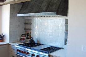 Brandner Design "Mountain Shadow" Zinc Oven Hood hand-formed and colored with a burnished black patina.