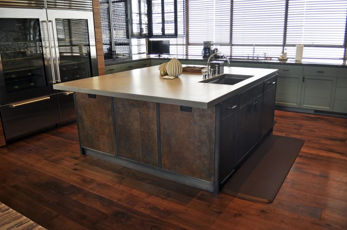 Obsidian Bar with hand-crafted steel cabinets clad in Brandner Design's Etched Steel with bronze pulls and hardware. The Bar Top is made from zinc with a slight charcoal patina.
