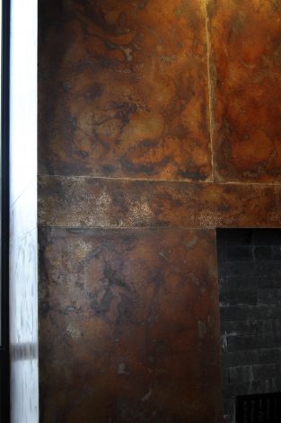 Brandner Design Obsidian Steel Fireplace Surround with an Autumn Veil Patina.