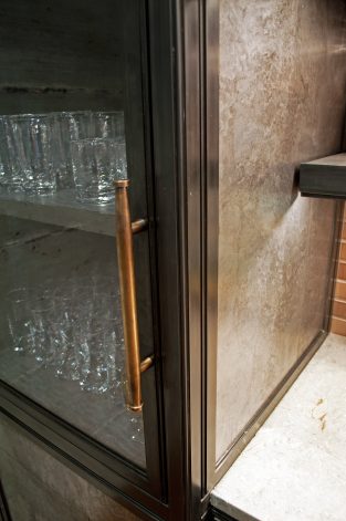 Brandner Design Obsidian Kitchen Cabinets with Hand-made Bronze pulls.