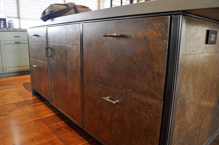 Obsidian Center Island with hand-crafted steel cabinets and Etched Steel with Bronze patina.