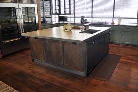 Obsidian Center Island with hand-crafted steel cabinets and Etched Steel with Bronze patina.