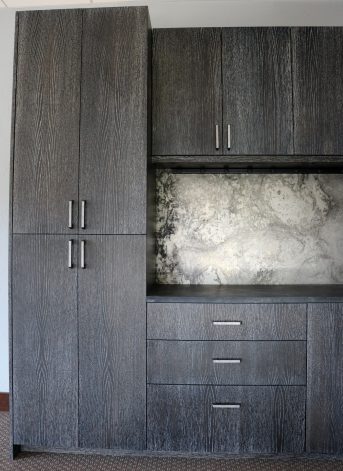 Brandner Design Midnight Oak Ceruse Cabinets with Etched Steel Back Splash.