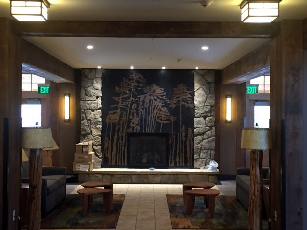Brandner Design Yellowstone Hotel Tree Wall Panels etched into the steel with acid patinas.