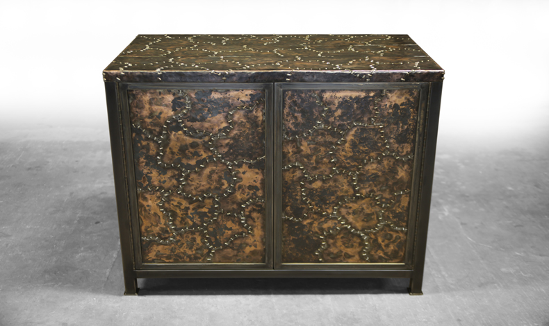 Ironclad cabinet with hammered and stitched finishing.