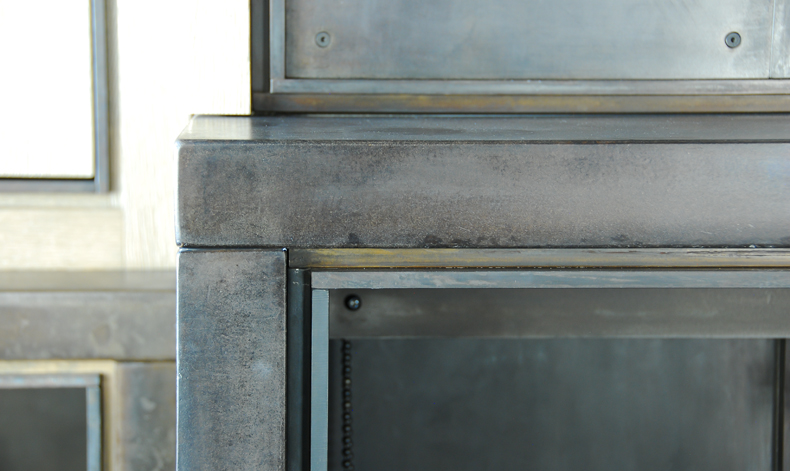 Lake Creek steel fireplace surround in Antique Brown Black Patina and countersunk screws.