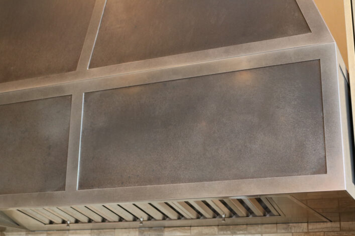 Eagle View Range Hood with Speckled Stainless patina.