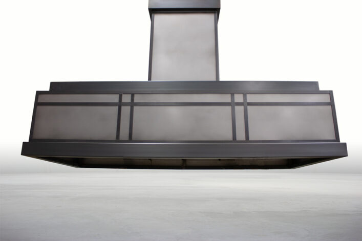 Mighty Island Range Hood with a Charcoal Stainless Patina.