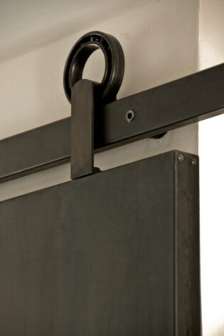 Modern Blackened Steel Sliding Door with a Directional Black Veil patina.