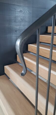 Cheney Lane Staircase white oak treads and a hammered and forged railing system.