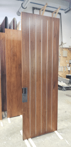Pinstripe Door with metal vertical inlays.