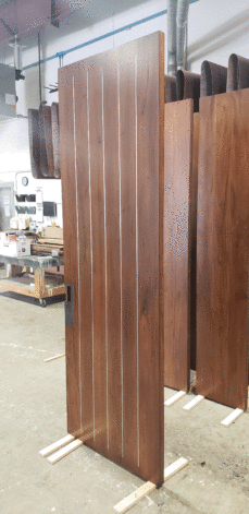 Pinstripe Door with metal vertical inlays.