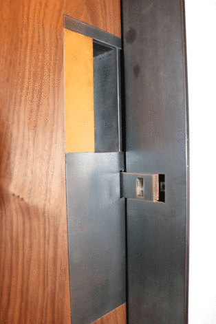 Book Matched Slab Door with Pocket Door Pull close-up.