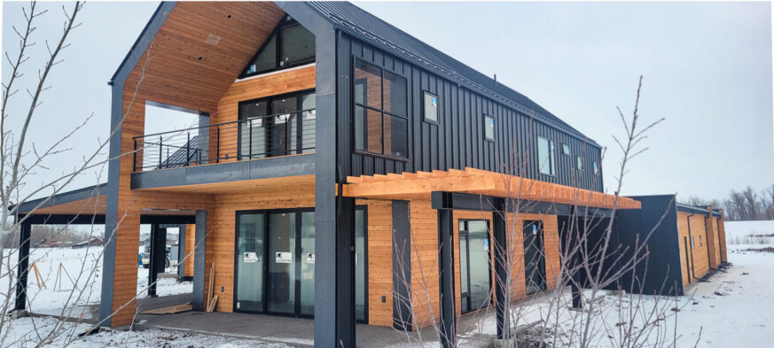 The Sales Place Residence with Hot Rolled Blackened Steel Overlapped Siding.