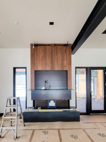 Hot Rolled Steel and Walnut Veneer Fireplace and TV Surround by Brandner Design